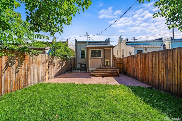 1024 34th St, Denver, CO 80205 - rear view of house featuring a fenced backyard and an outbuilding