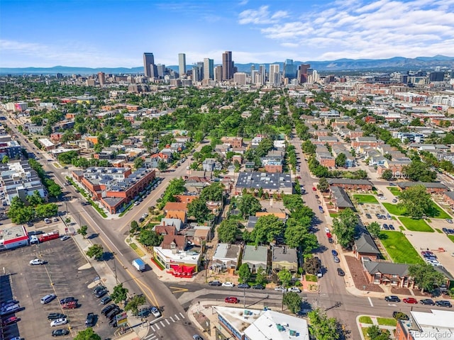 1024 34th St, Denver, CO 80205 - aerial view of city skyline and a mountainous background