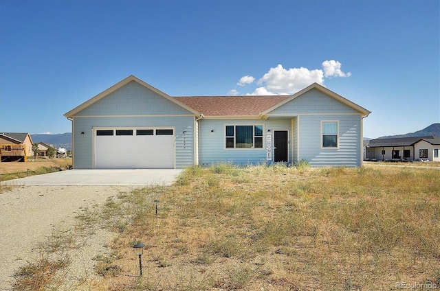 ranch-style house featuring a garage