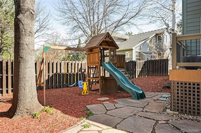 view of playground with a fenced backyard
