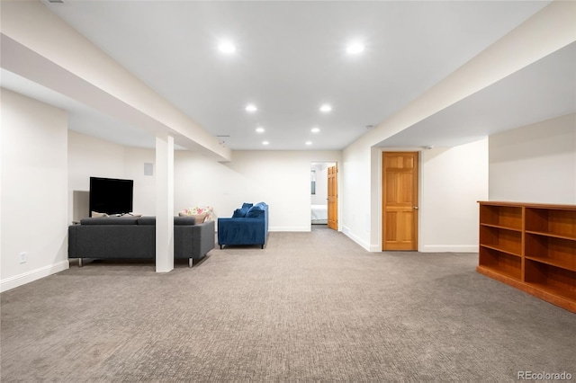 unfurnished living room with recessed lighting, carpet floors, and baseboards
