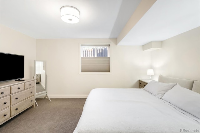 bedroom featuring carpet floors and baseboards