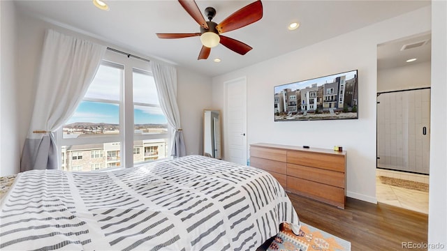 bedroom with hardwood / wood-style flooring and ceiling fan