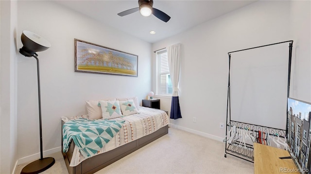 carpeted bedroom with ceiling fan