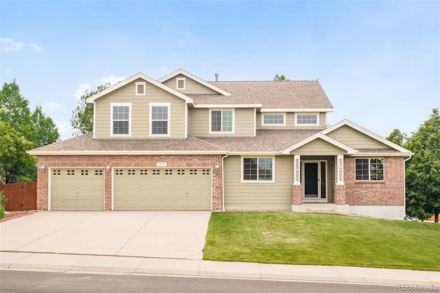 1477 Serene Dr, Erie, CO 80516 - view of front facade featuring a garage, brick siding, concrete driveway, and a shingled roof