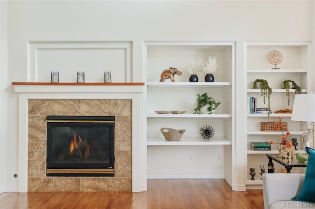 1477 Serene Dr, Erie, CO 80516 - detailed view of wood finished floors and a tiled fireplace