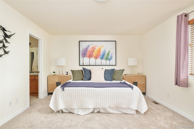 1477 Serene Dr, Erie, CO 80516 - bedroom featuring light colored carpet, baseboards, and ensuite bath
