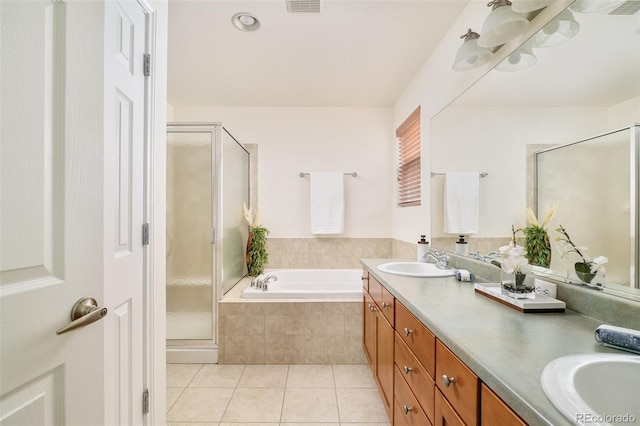1477 Serene Dr, Erie, CO 80516 - bathroom with a bath, double vanity, a stall shower, and tile patterned flooring