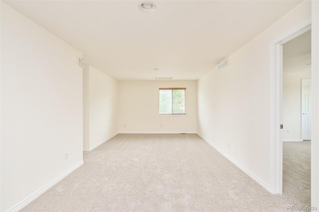 1477 Serene Dr, Erie, CO 80516 - spare room featuring light carpet and baseboards