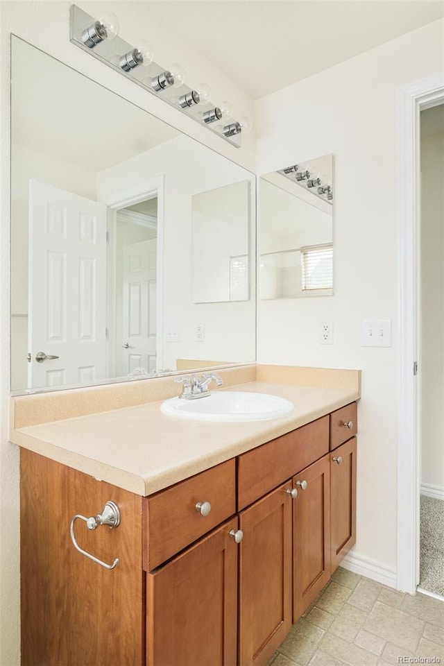 1477 Serene Dr, Erie, CO 80516 - bathroom featuring vanity and baseboards