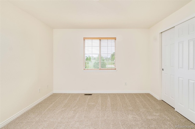 1477 Serene Dr, Erie, CO 80516 - unfurnished bedroom with light carpet, baseboards, and a closet