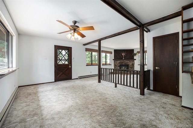 foyer entrance featuring carpet flooring, baseboard heating, a ceiling fan, baseboards, and a baseboard radiator
