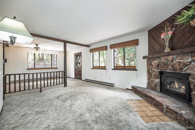 unfurnished living room with carpet flooring, ceiling fan, a healthy amount of sunlight, and a baseboard radiator