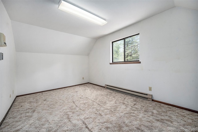 additional living space featuring carpet floors, baseboards, baseboard heating, and lofted ceiling