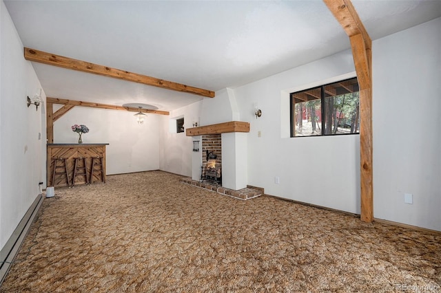 unfurnished living room with baseboard heating, beam ceiling, carpet floors, a brick fireplace, and baseboards
