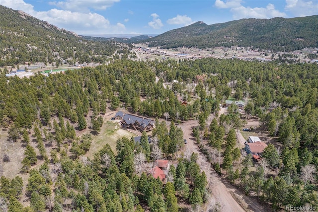 bird's eye view with a view of trees and a mountain view