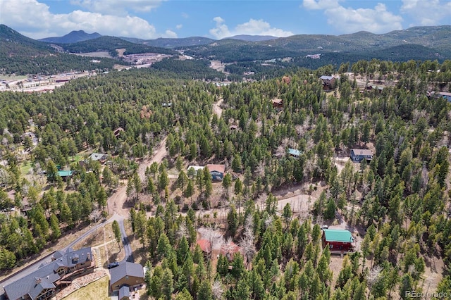 drone / aerial view with a view of trees and a mountain view
