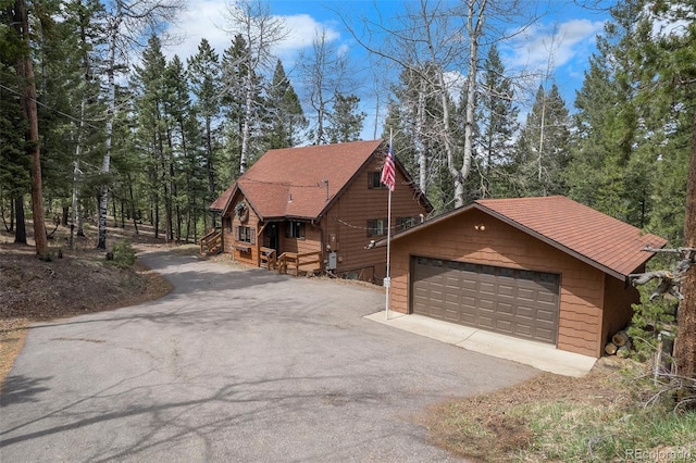 view of home's exterior featuring aphalt driveway