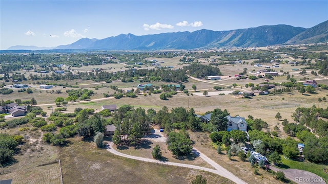 birds eye view of property featuring a mountain view