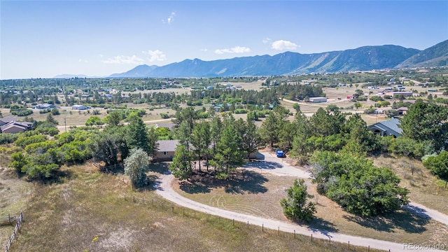 birds eye view of property featuring a mountain view