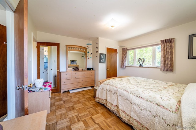 bedroom with parquet flooring