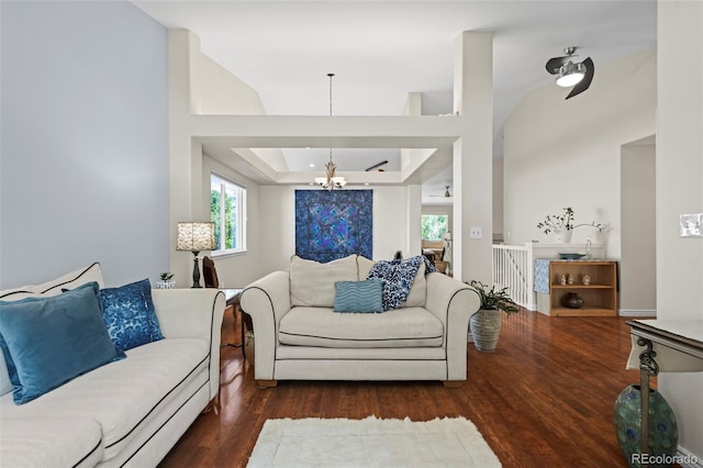 1376 Banner Cir, Erie, CO 80516 - living room featuring a chandelier, wood finished floors, and a raised ceiling