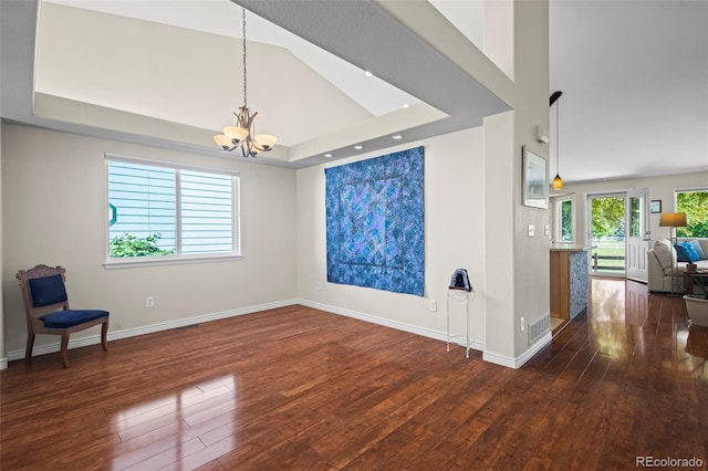 1376 Banner Cir, Erie, CO 80516 - unfurnished room featuring hardwood / wood-style flooring, a chandelier, and a raised ceiling