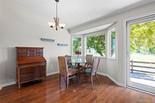 1376 Banner Cir, Erie, CO 80516 - dining room featuring a chandelier and dark wood-type flooring