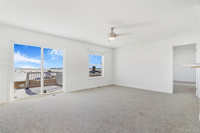 spare room with carpet floors and ceiling fan