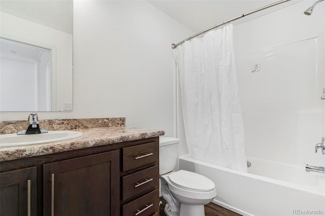 full bathroom with vanity, shower / bath combination with curtain, and toilet