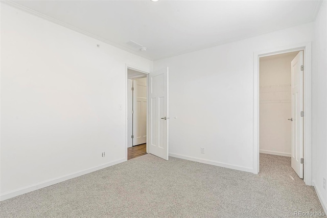 empty room with light colored carpet