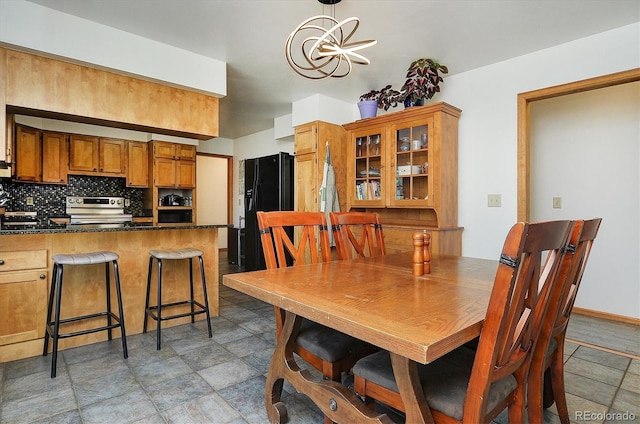 510 Crossman Ave, Buena Vista, CO 81211 - dining area featuring stone finish flooring and a chandelier