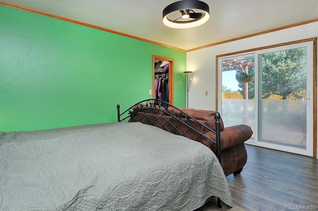 510 Crossman Ave, Buena Vista, CO 81211 - bedroom featuring access to exterior, wood finished floors, crown molding, a walk in closet, and a closet