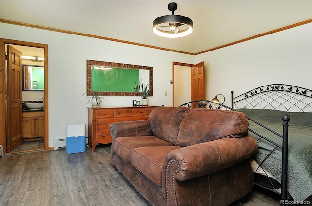 510 Crossman Ave, Buena Vista, CO 81211 - living area with wood finished floors, baseboard heating, and crown molding