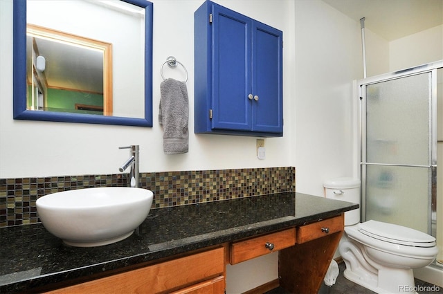 510 Crossman Ave, Buena Vista, CO 81211 - bathroom with tasteful backsplash, a shower stall, and vanity