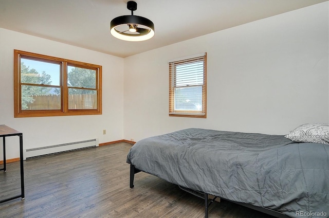 510 Crossman Ave, Buena Vista, CO 81211 - bedroom with a baseboard radiator and wood finished floors