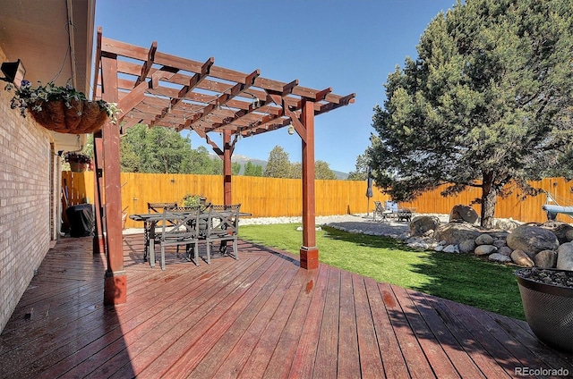 510 Crossman Ave, Buena Vista, CO 81211 - wooden deck with outdoor dining area, a pergola, and a fenced backyard