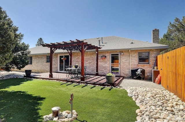 510 Crossman Ave, Buena Vista, CO 81211 - rear view of property featuring a pergola, a wooden deck, a chimney, brick siding, and roof with shingles