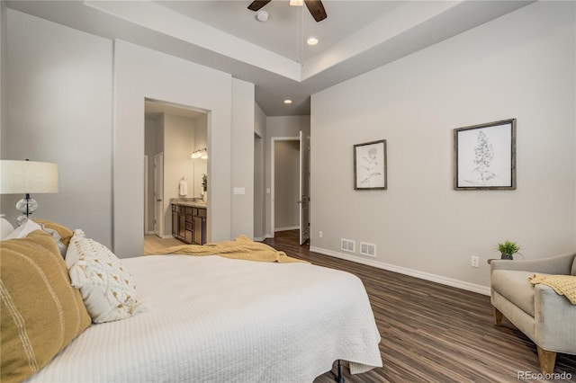 bedroom featuring connected bathroom, recessed lighting, wood finished floors, visible vents, and baseboards