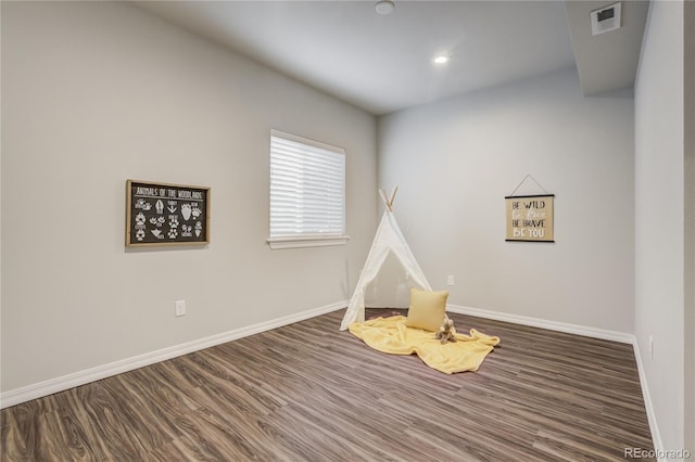 playroom featuring baseboards, visible vents, wood finished floors, and recessed lighting