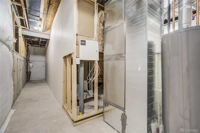 utility room featuring water heater