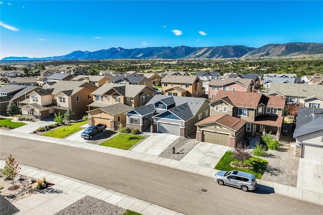 drone / aerial view featuring a mountain view and a residential view