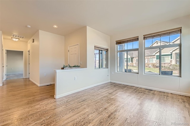 12625 Madison Way, Thornton, CO 80241 - unfurnished room featuring visible vents, light wood-style flooring, and baseboards
