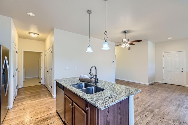 12625 Madison Way, Thornton, CO 80241 - kitchen with light wood-style floors, ceiling fan, light stone counters, a sink, and stainless steel appliances