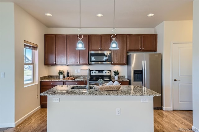 12625 Madison Way, Thornton, CO 80241 - kitchen with stainless steel appliances, decorative light fixtures, light wood-type flooring, and stone counters