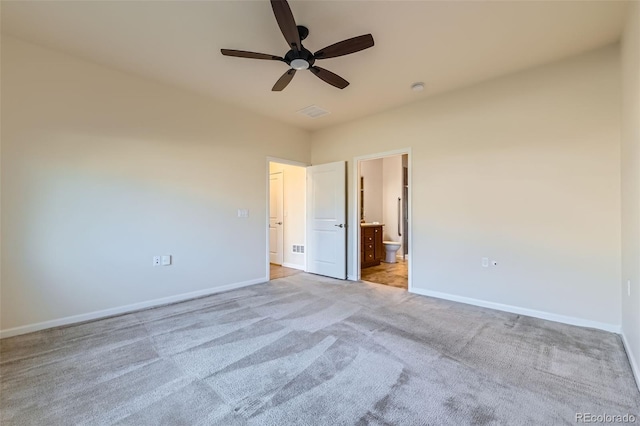 12625 Madison Way, Thornton, CO 80241 - unfurnished bedroom with visible vents, baseboards, a ceiling fan, ensuite bath, and light colored carpet