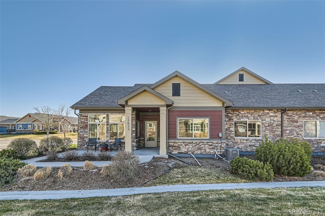12625 Madison Way, Thornton, CO 80241 - view of front facade with stone siding and roof with shingles