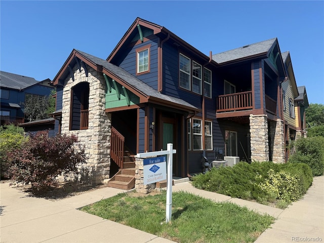 2552 W 82nd Ln Unit C, Westminster, CO 80031 - view of front of property with a balcony and stone siding