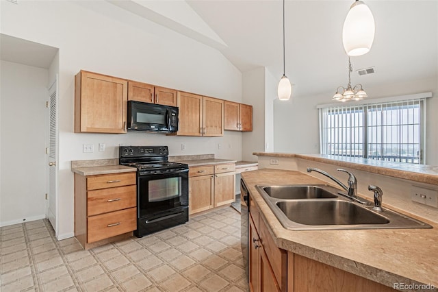 2552 W 82nd Ln Unit C, Westminster, CO 80031 - kitchen with black appliances, vaulted ceiling, light countertops, hanging light fixtures, and a chandelier