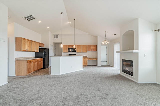 2552 W 82nd Ln Unit C, Westminster, CO 80031 - kitchen featuring black appliances, high vaulted ceiling, light carpet, open floor plan, and light countertops